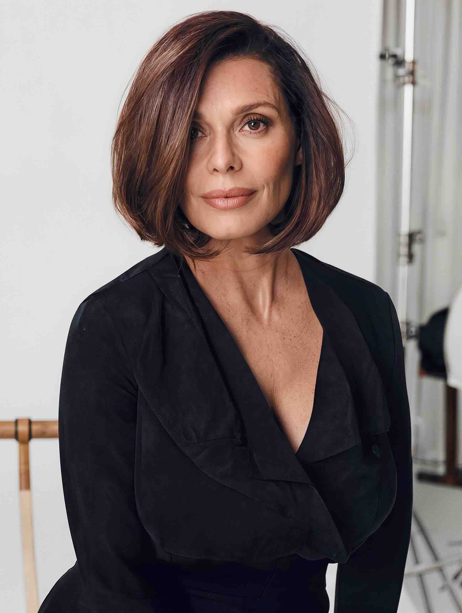 Modern long bob haircut for a plus-size woman over 40