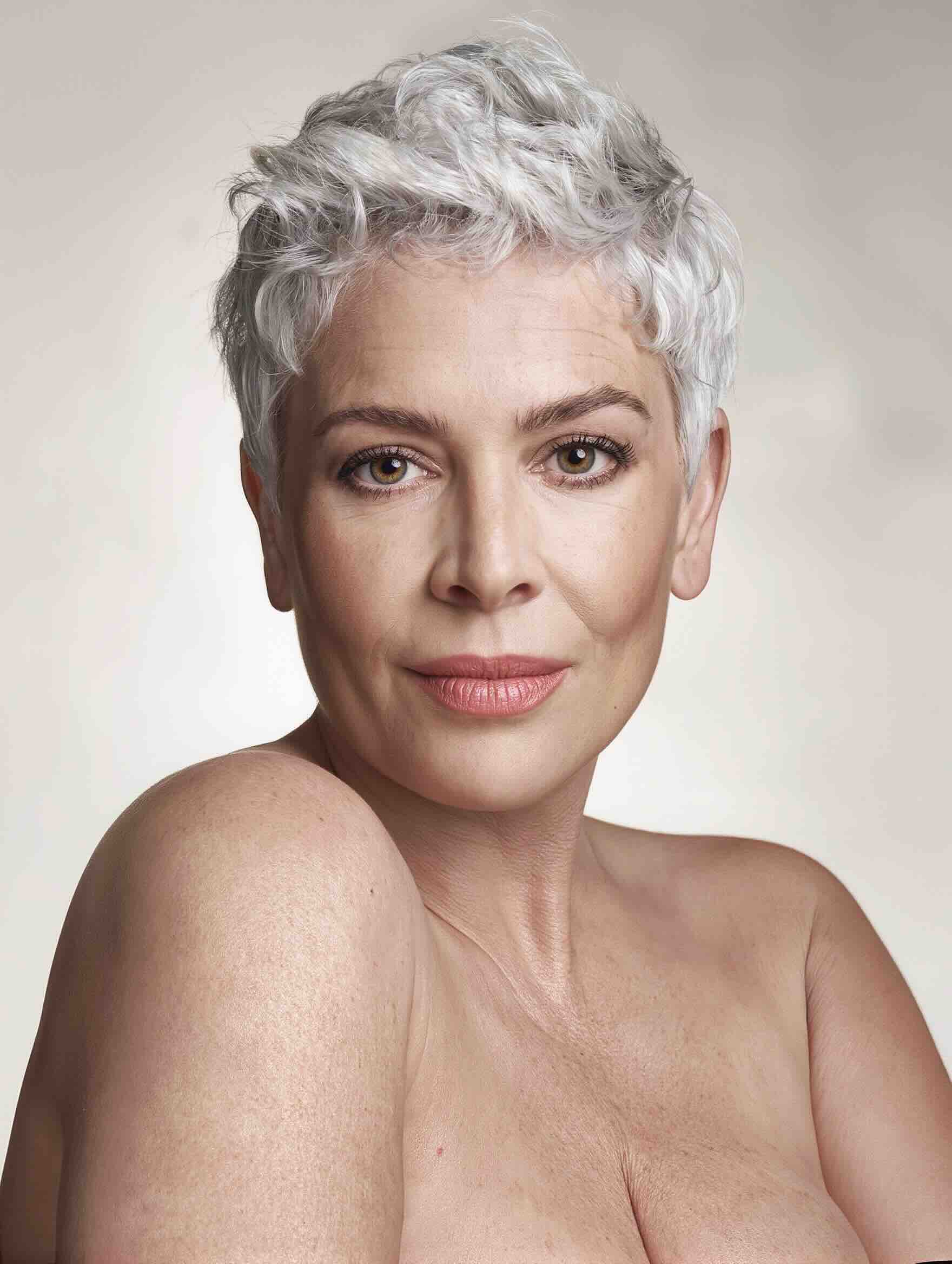 Textured pixie haircut with side-swept fringe for a plus-size woman over 40