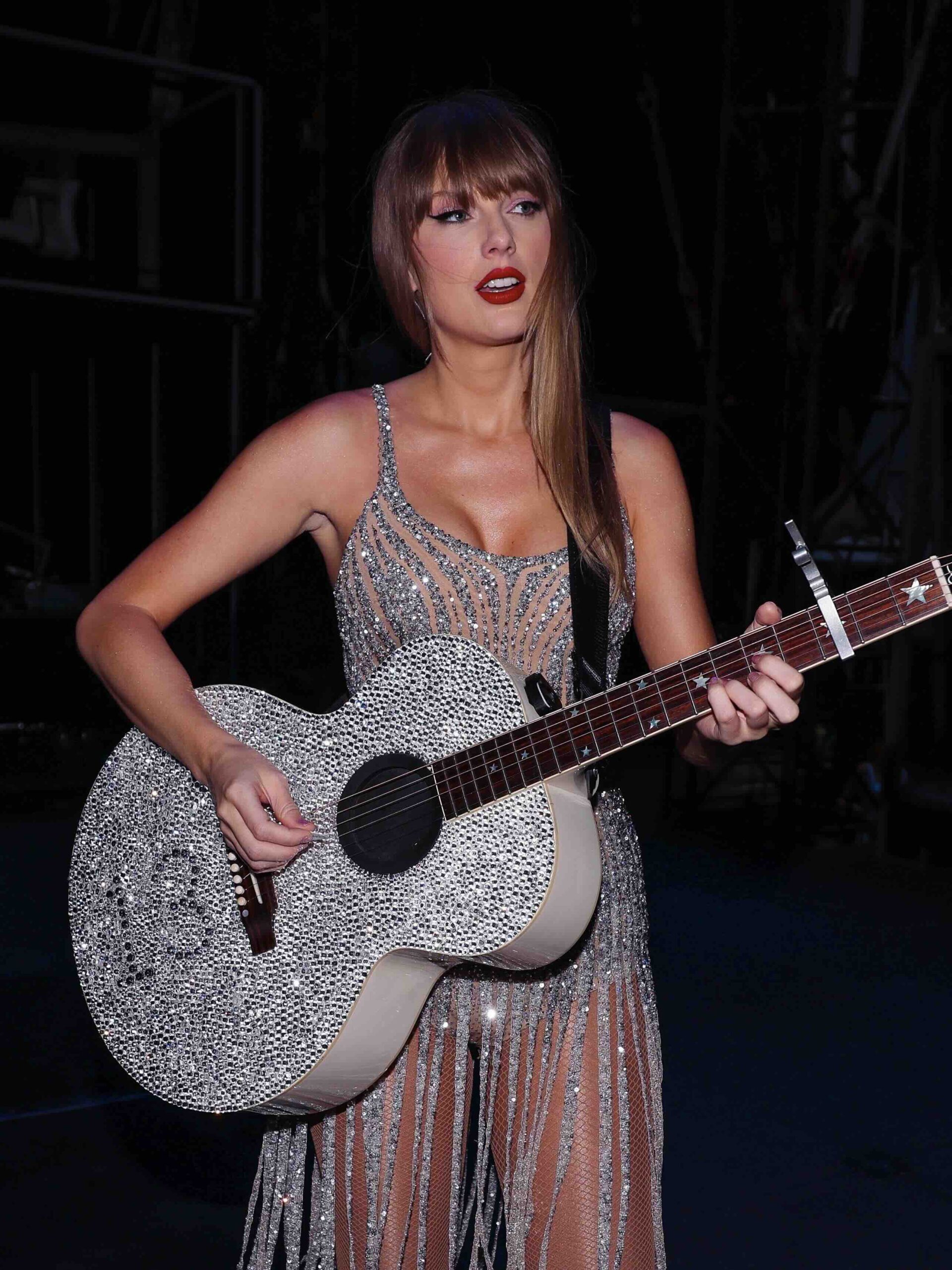 Taylor Swift in a pastel corset-bodice midi dress